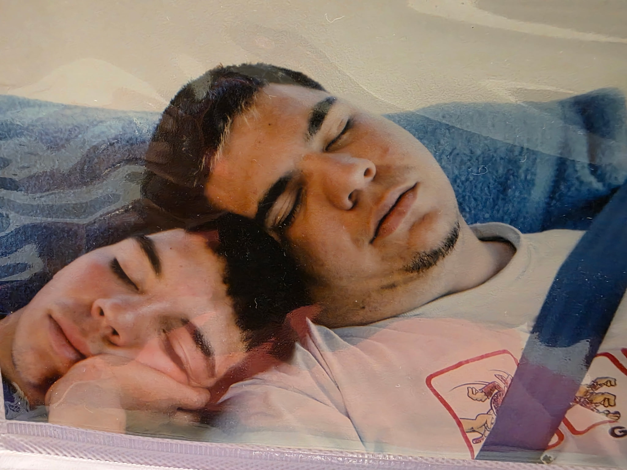 Carlos and Ricky sleeping in the minivan