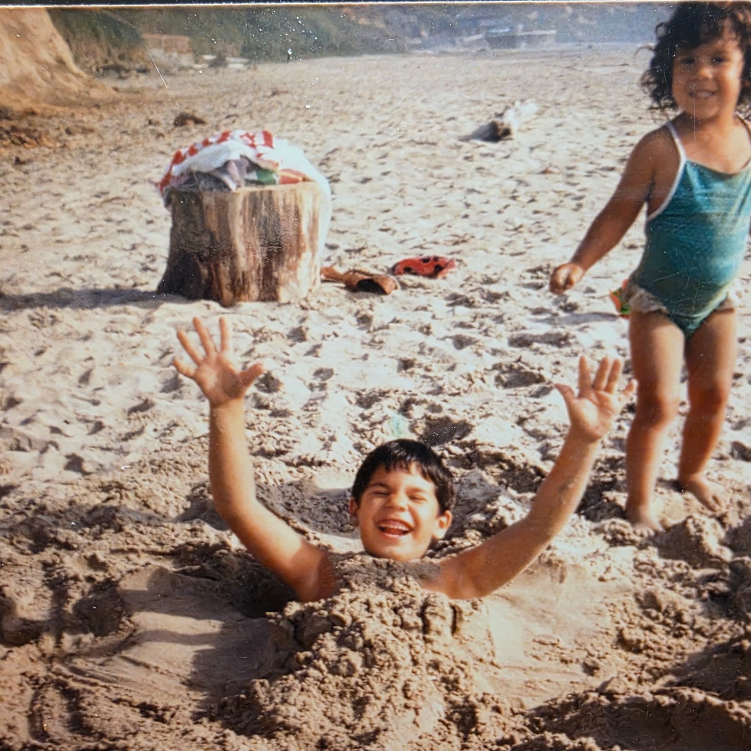 Teresa and her brother as kids at the beach